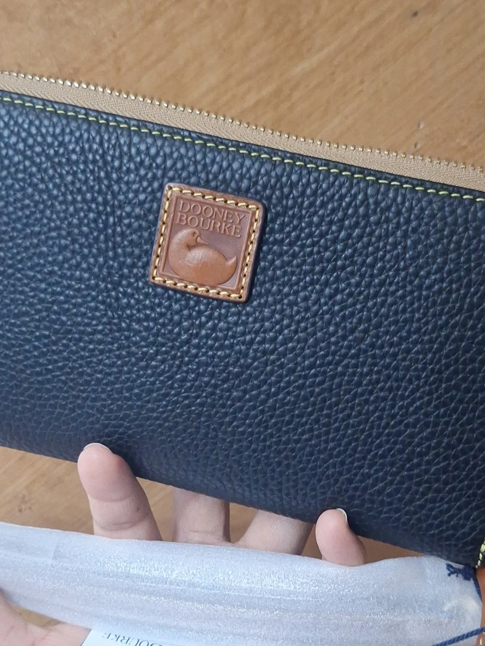 Dooney & Bourke Black Pebbled Zip Wallet with Tan Trim